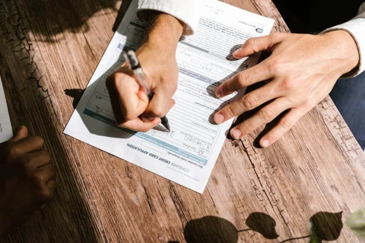 Lawyer reviewing debt recovery documents at a professional office